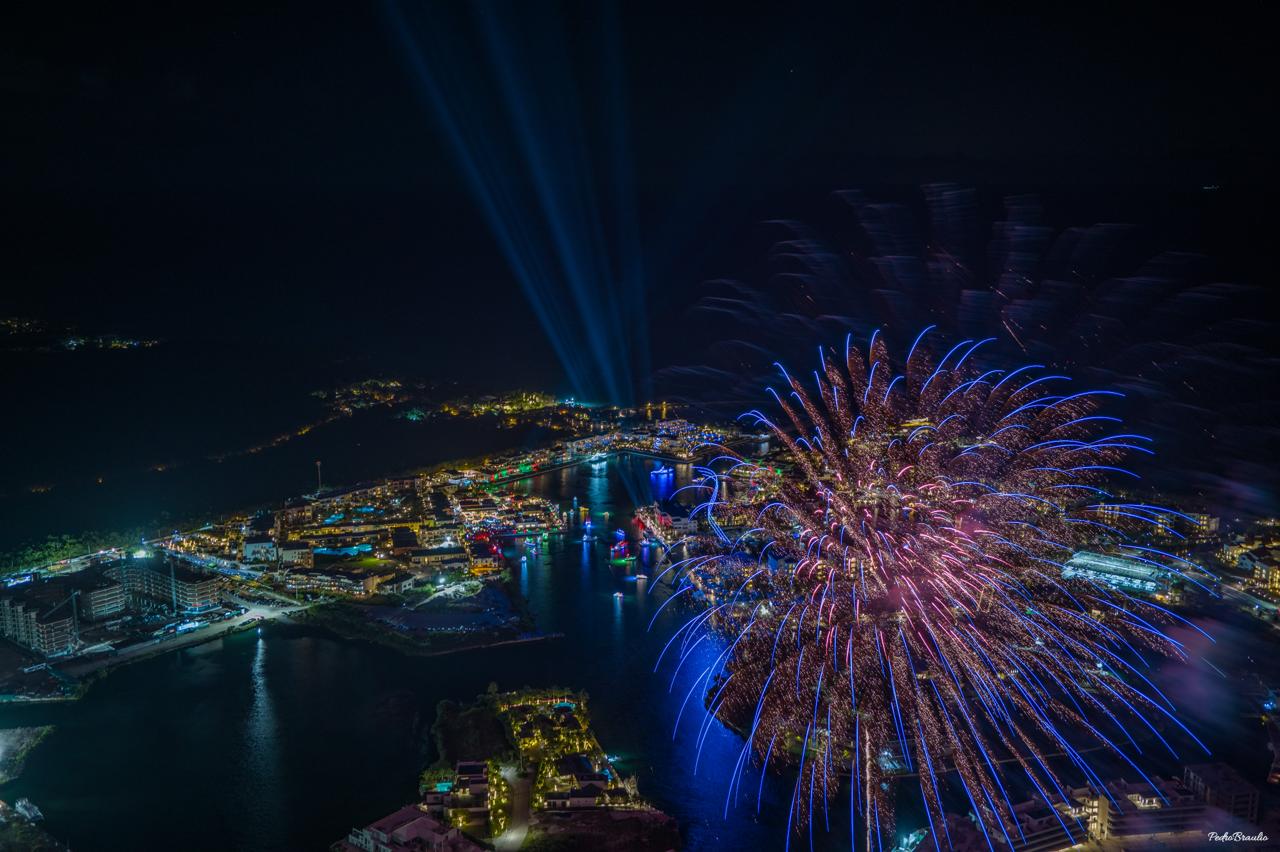 Cap Cana Christmas Boat Parade — aerial view with fireworks over the marina