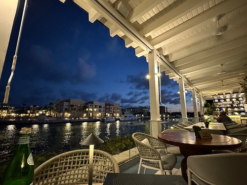 Waterfront dining overlooking Marina Cap Cana at night